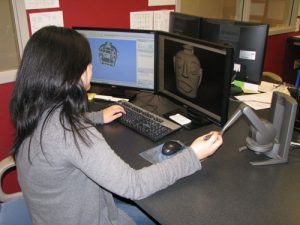 Biomedical engineering student Nora Huang defines features using the Phantom haptic device with Geomagic Freeform software.