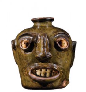The original 19th-century face jug from Edgefield, South Carolina. Courtesy of the Chipstone Foundation.