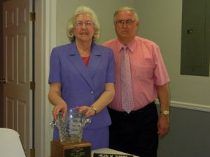 Retiring mayor, Helen Summer, being honored by new mayor, Billy Padgett, with an ornamental vase at the monthly meeting of the Trenton Council, Wed., Apr. 10.