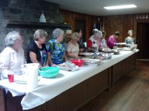 Some of the 25 cooks who prepared dishes for the guests.