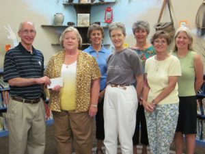 Edgefield County Council Chairman Dean Campbell, left, presents a personal donation to the Library Project to the Friends of the Edgefield County Library, to help start the donation as part of this year’s Chairman’s Community Project. Accepting the donation is Ann Day, Friends President, with other Friends members, from left, Cynthia Bull, Laurel Blossom, Patricia Bryan (also Edgefield County Library Board Member), Elaine Parker, and Mary Jo Dawson, ABBE Regional Library Director. The fundraising Project runs throughout the month of September.