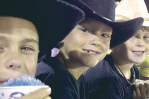 Alex Riley, Jackson Harling and Tripp Nunamaker in their cowboy hats at last year’s rodeo.