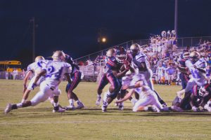 #5 Trevonte Watkins breaks through the line to score a second quarter touchdown for the STHS Rebels.