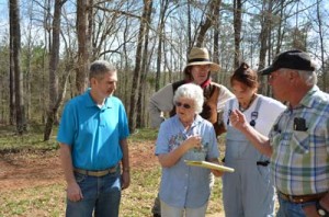 Father Tom DiMarco,  Clarice Wise, Billy Benton,  Brenda Bancroft and Buck Carpenter go over plans for next Sunday’s celebration.