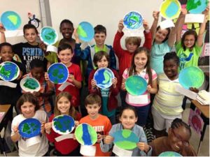 Mrs. Parker’s 4th grade students holding their Earth Day promises.