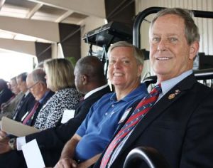 Sen. Lindsey Graham and Rep. Joe Wilson join Aiken Electric Board of Trustees on stage for Aiken Electric Cooperative’s annual meeting May 17.