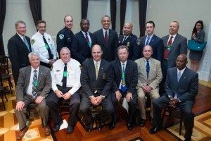 President Barack Obama has a group photo with law enforcement leaders after remarks during a law enforcement briefing on immigration in Room 350 of the Eisenhower Executive Office Building of the White House, May 13, 2014. (Official White House Photo by Pete Souza)