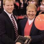 Fox Creek's coach Andrew Peckham receives a 100 career win plaque from his high school coach Lonnie Emard who coached him at Ben Lippen in Columbia. Coach Peckham had fifty five wins while coaching at Covenant Christian School in Columbia and has forty five wins at Fox Creek.