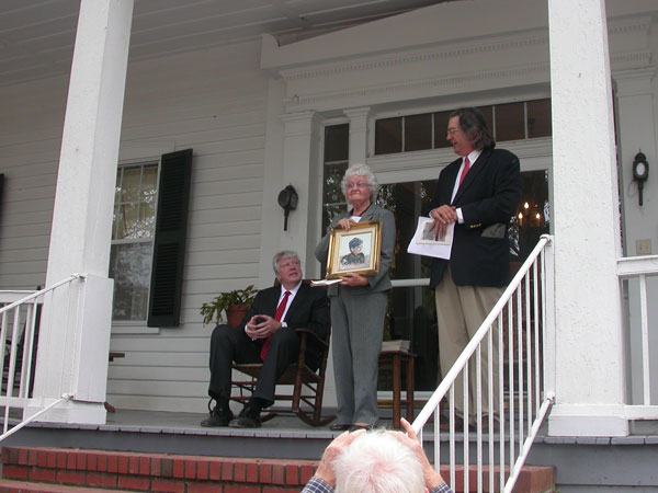 A Cannon Fires: a Marker is Unveiled