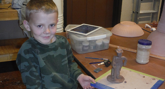 Youths Work with Clay at Local Studio
