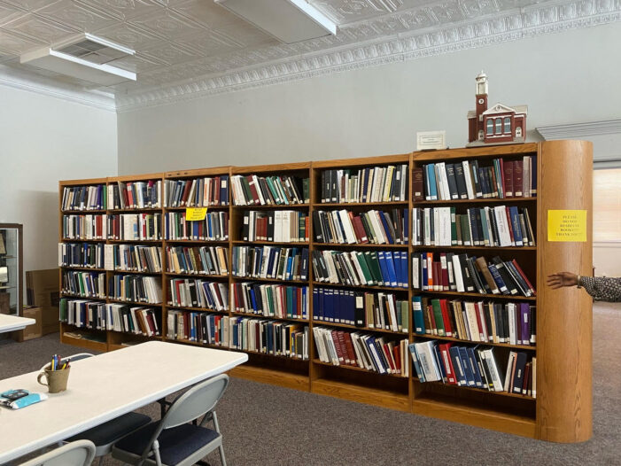 WITH FAMILY BOOKS AND FILES IN CONTENTION <strong>PAST MEETS PRESENT ON COURT HOUSE SQUARE</strong>